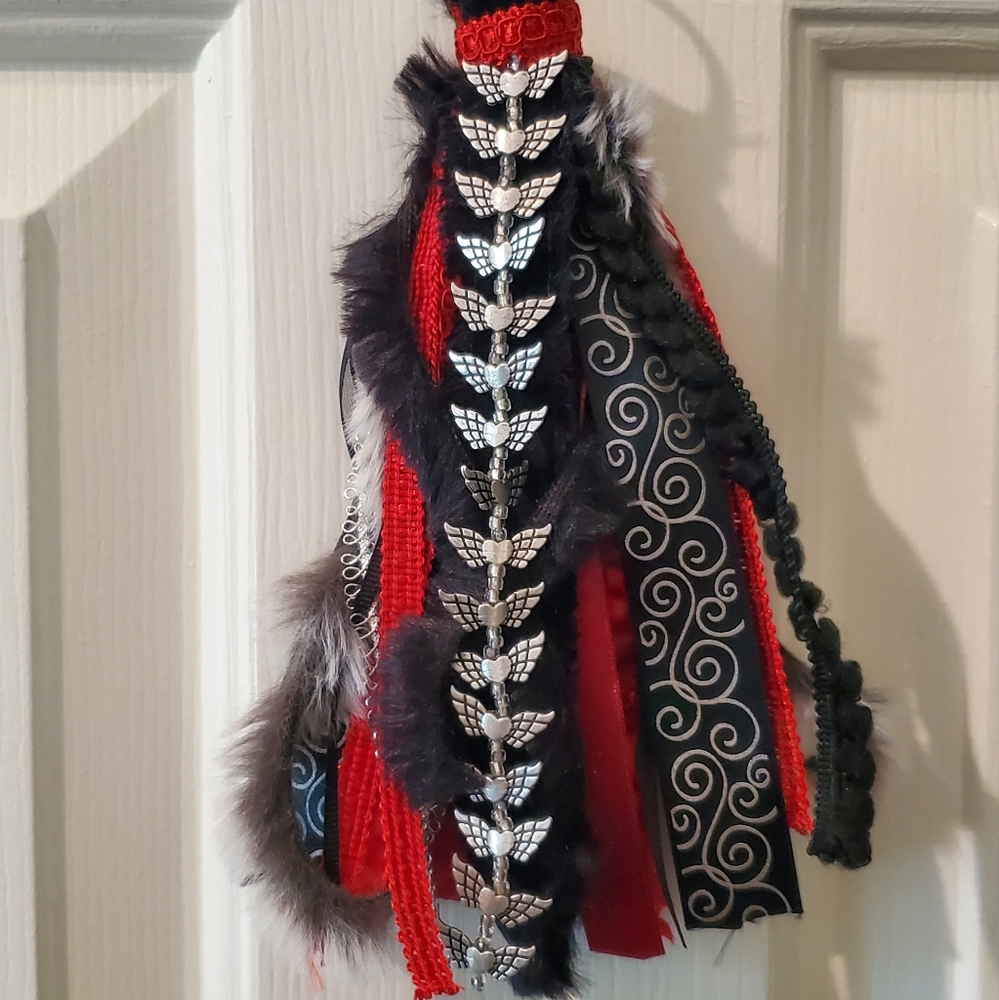 Black and Red homemade Tassel. 10 inches long and 5 inches wide.